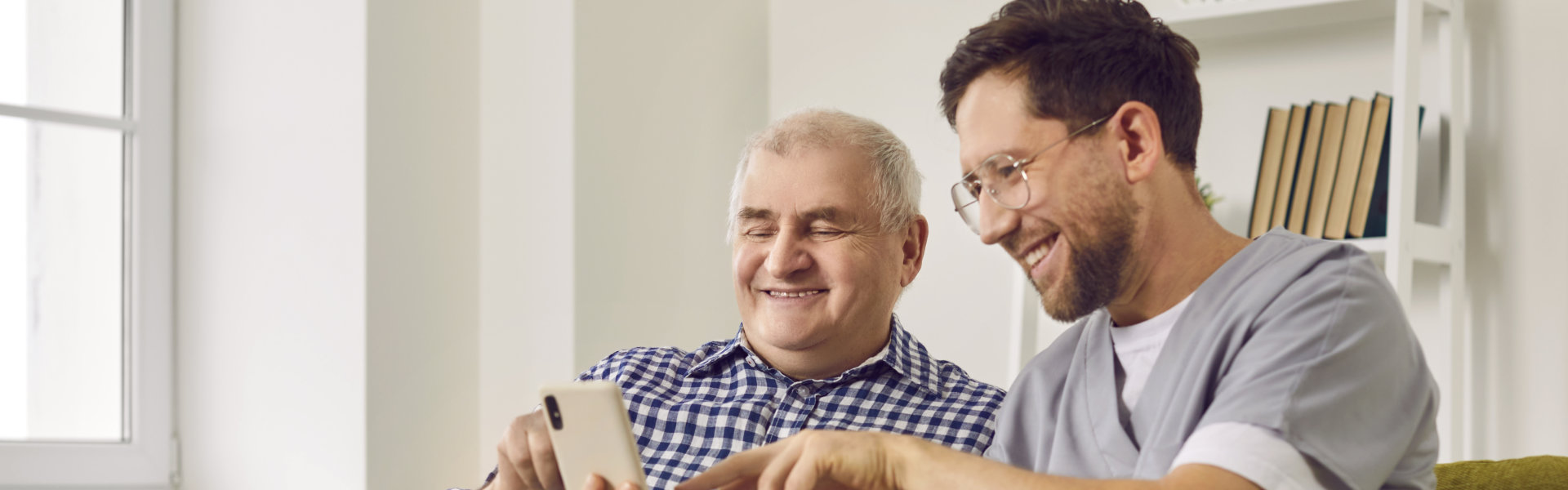 Two person watching on a phone