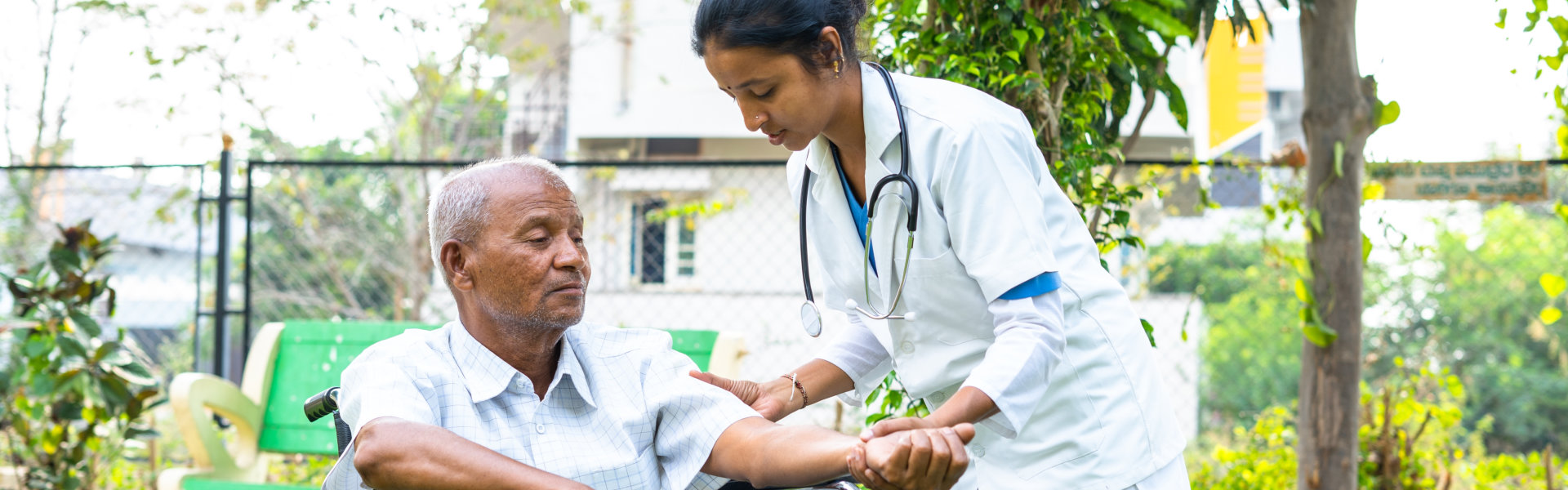 senior man assisted by nurse